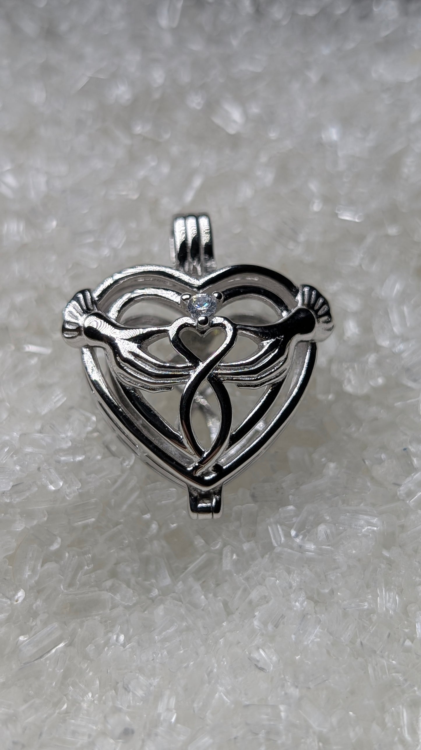 Hand holding heart large cage