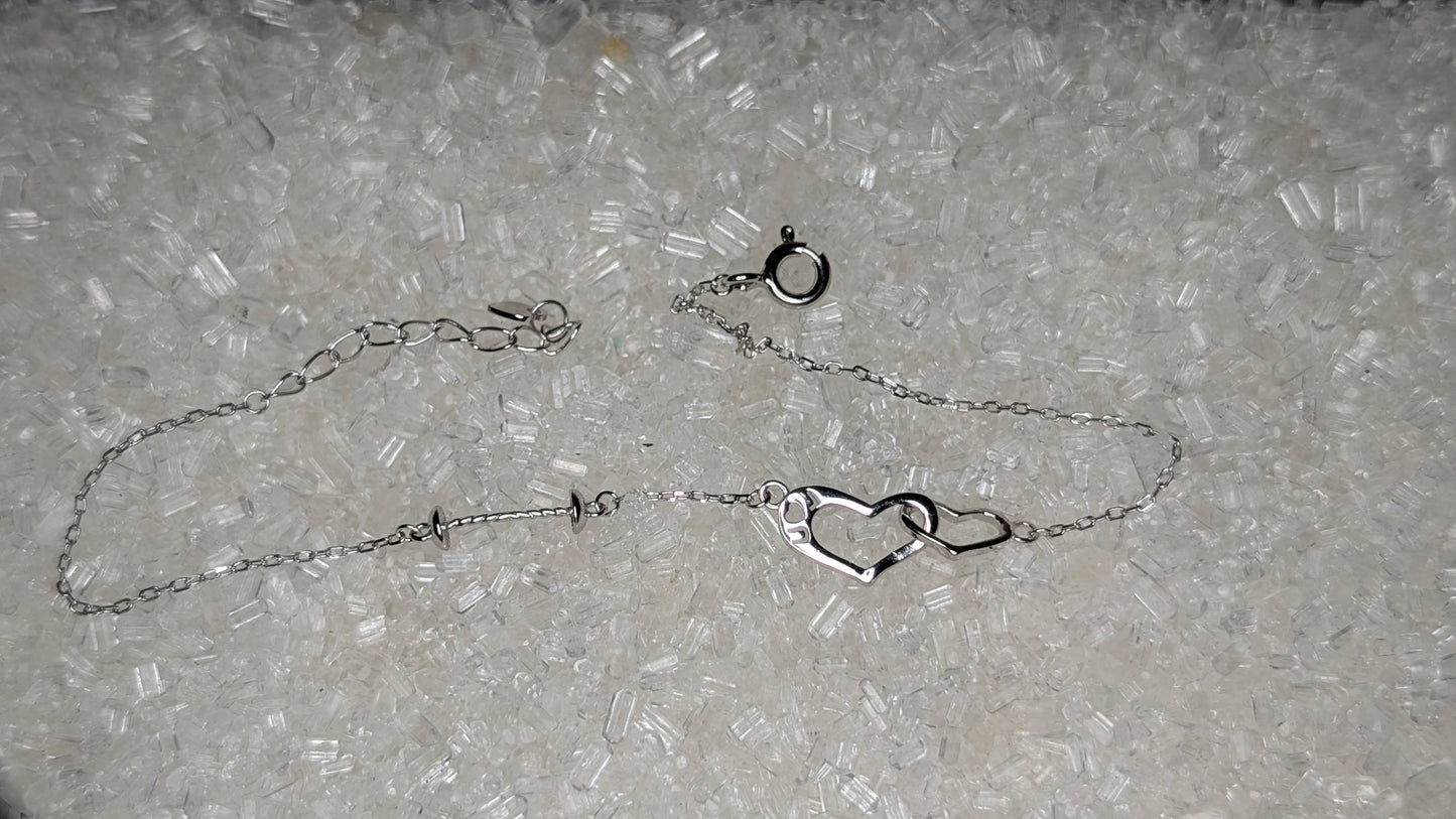 Suspended pearl heart bracelet