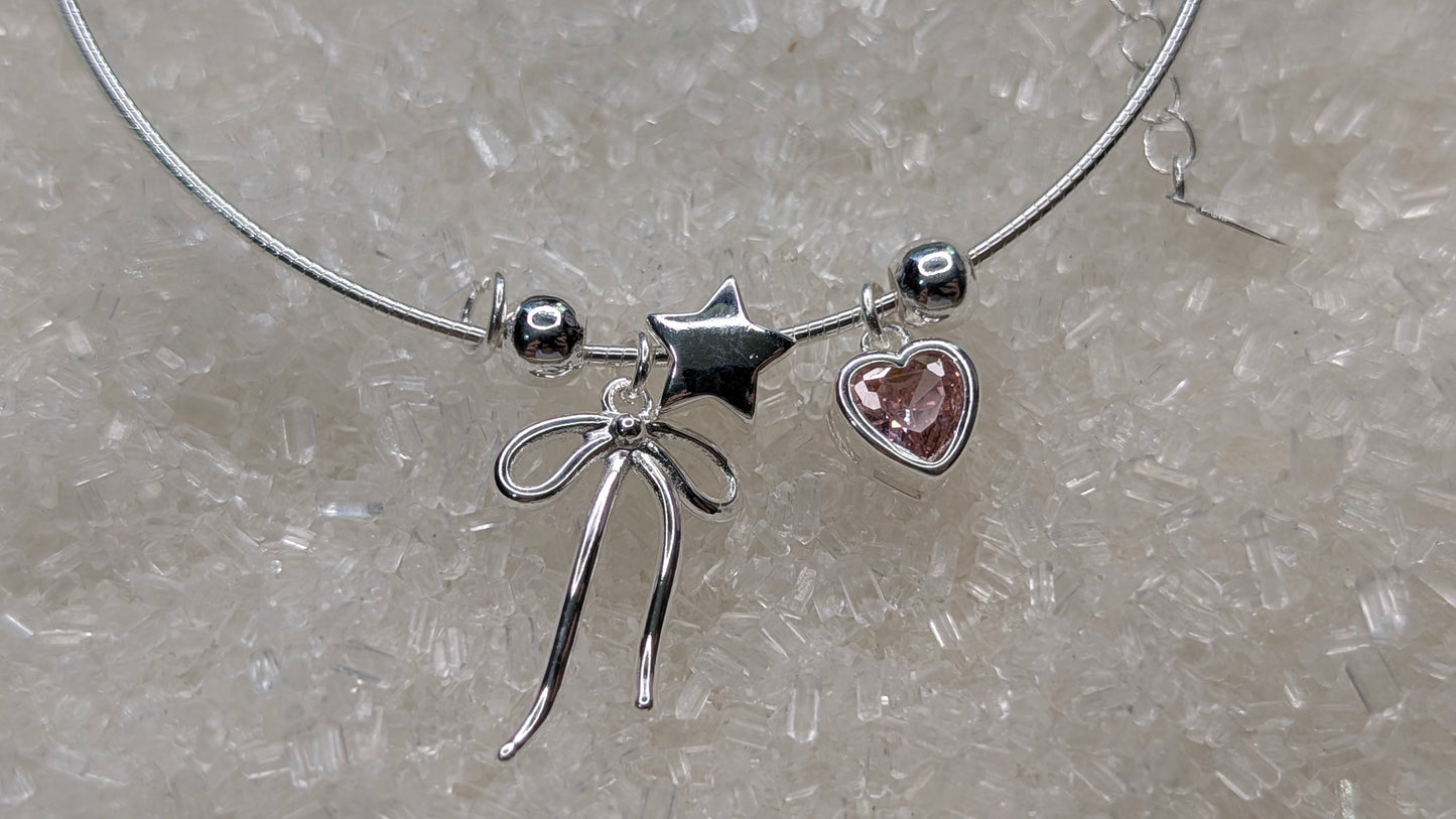 Pink heart, bow and pearl charm bangle