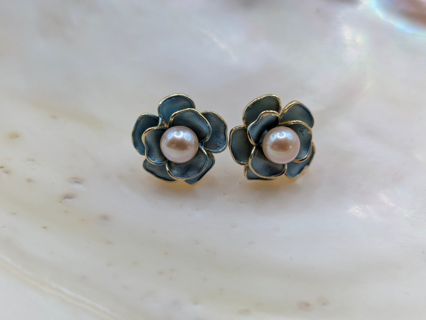 Gold flower earrings with green enamel petals and freshwater pearls