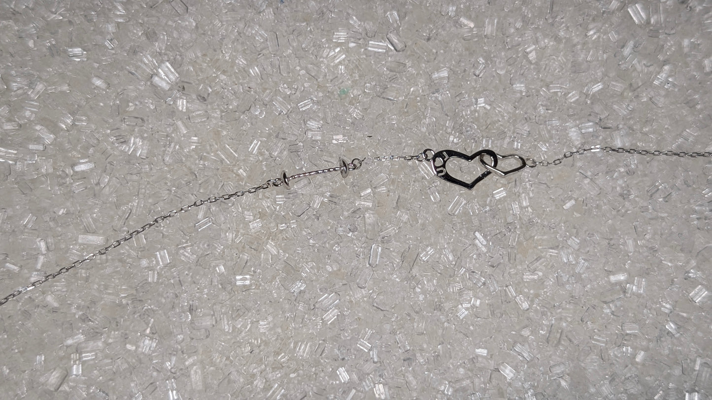 Suspended pearl heart bracelet