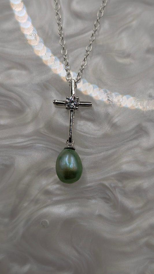 Silver cross with green pearl dangle