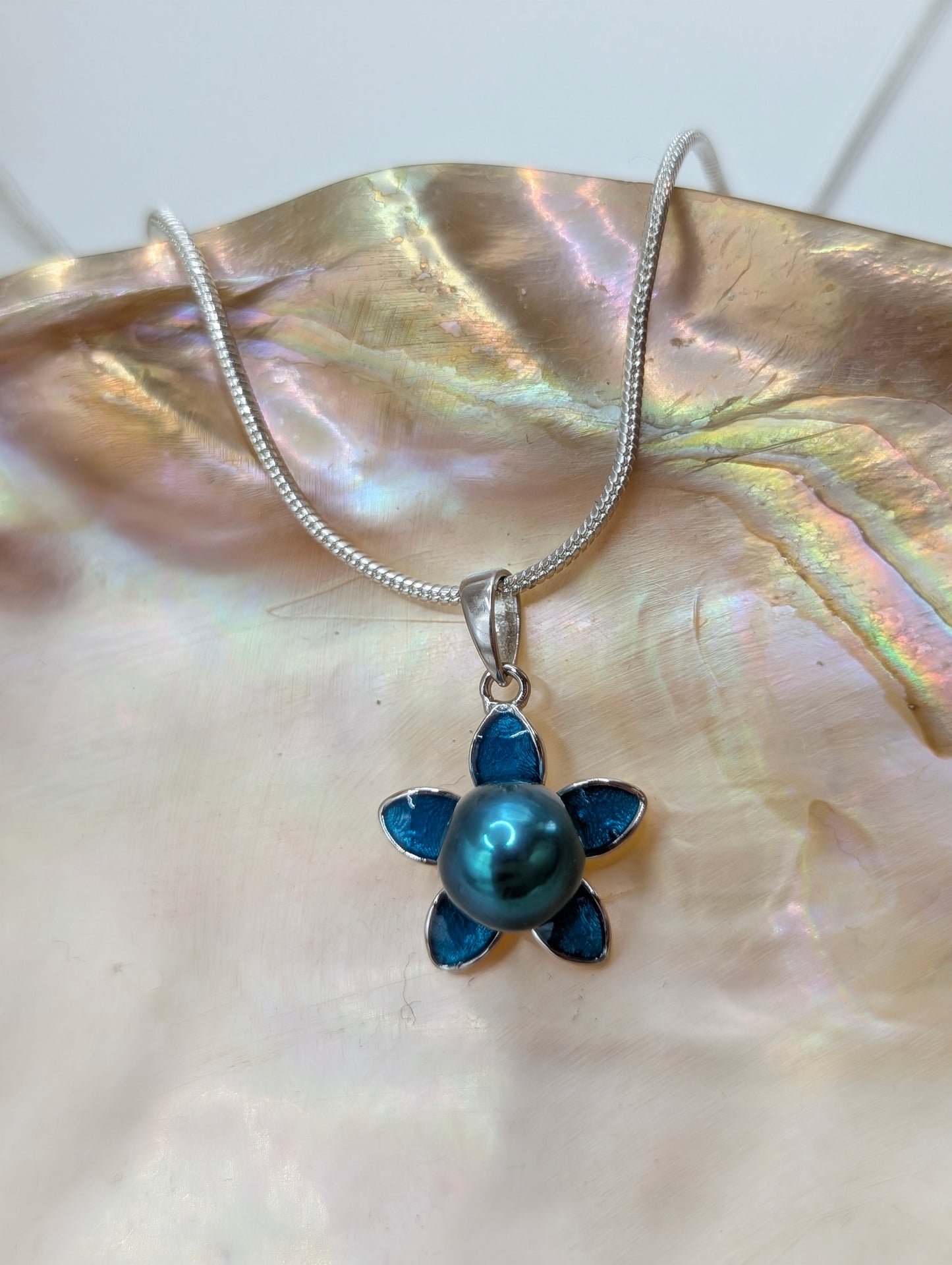 Blue/teal pearl flower pendant