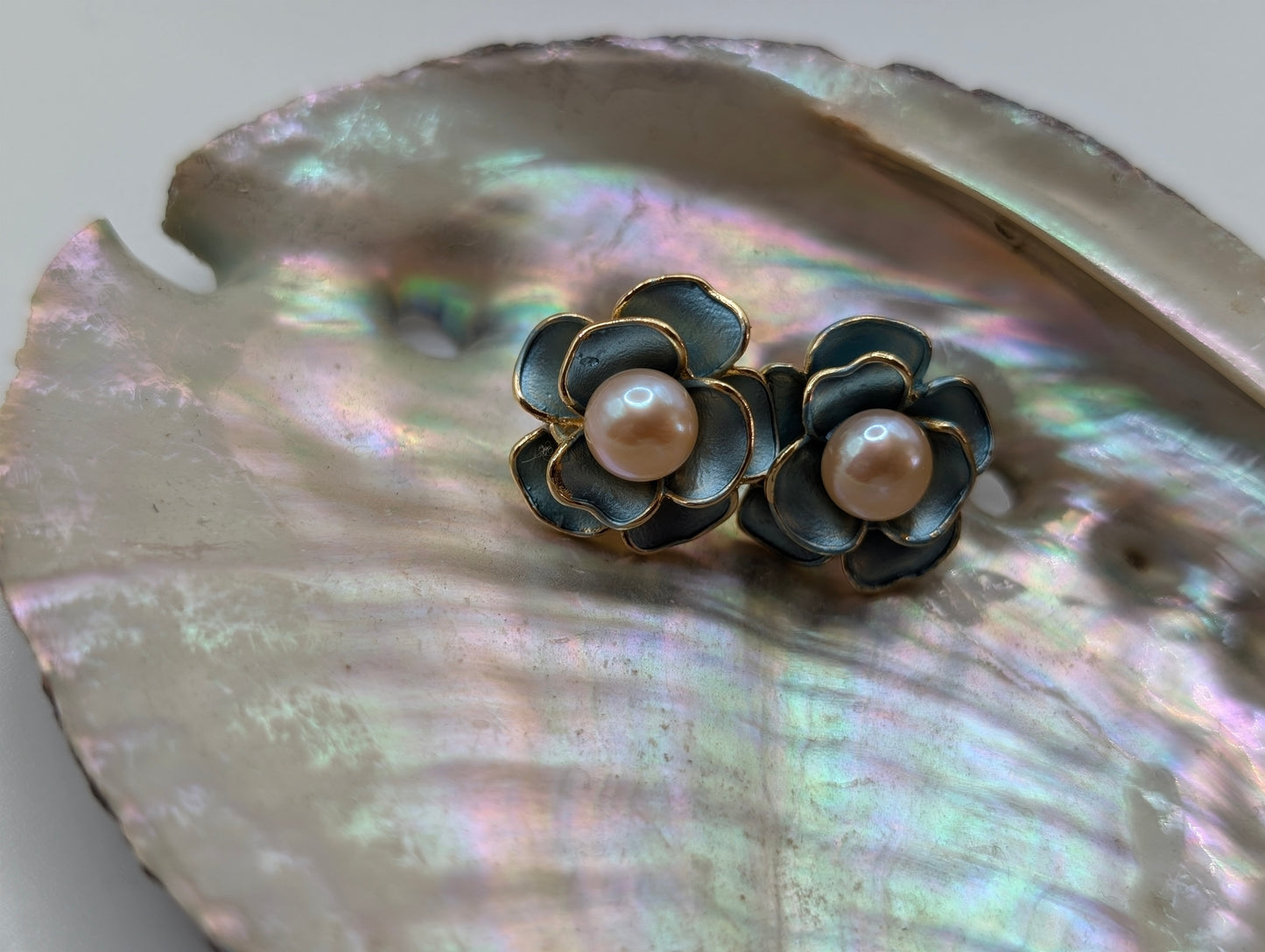 Gold flower earrings with green enamel petals and freshwater pearls