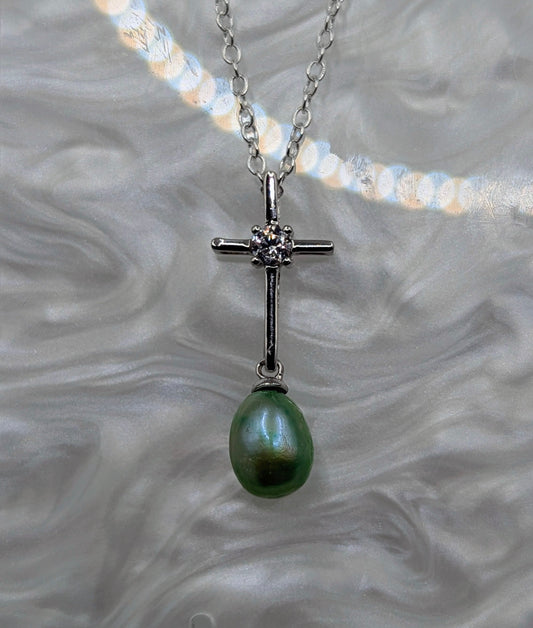 Silver cross with green pearl dangle