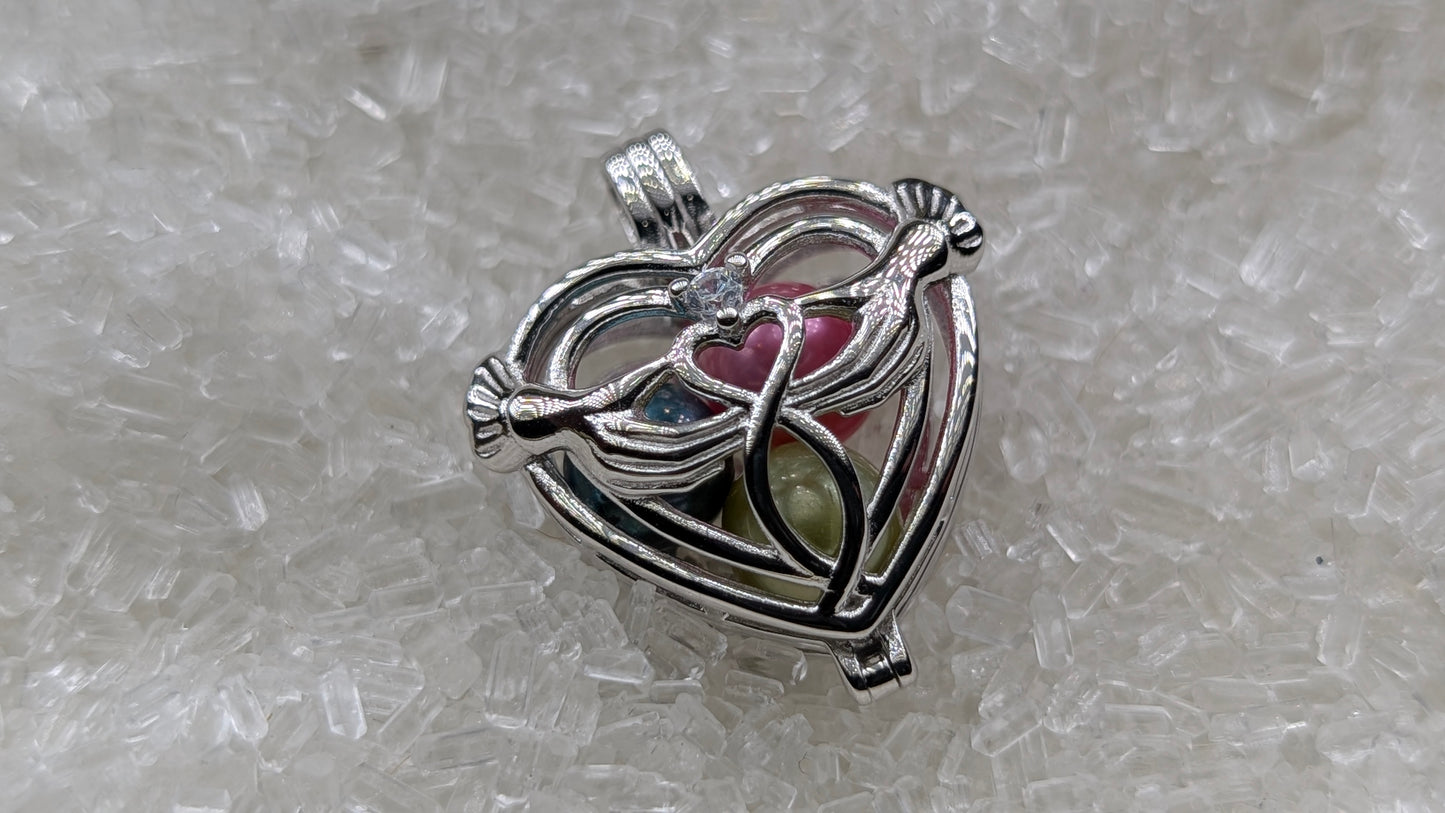 Hand holding heart large cage