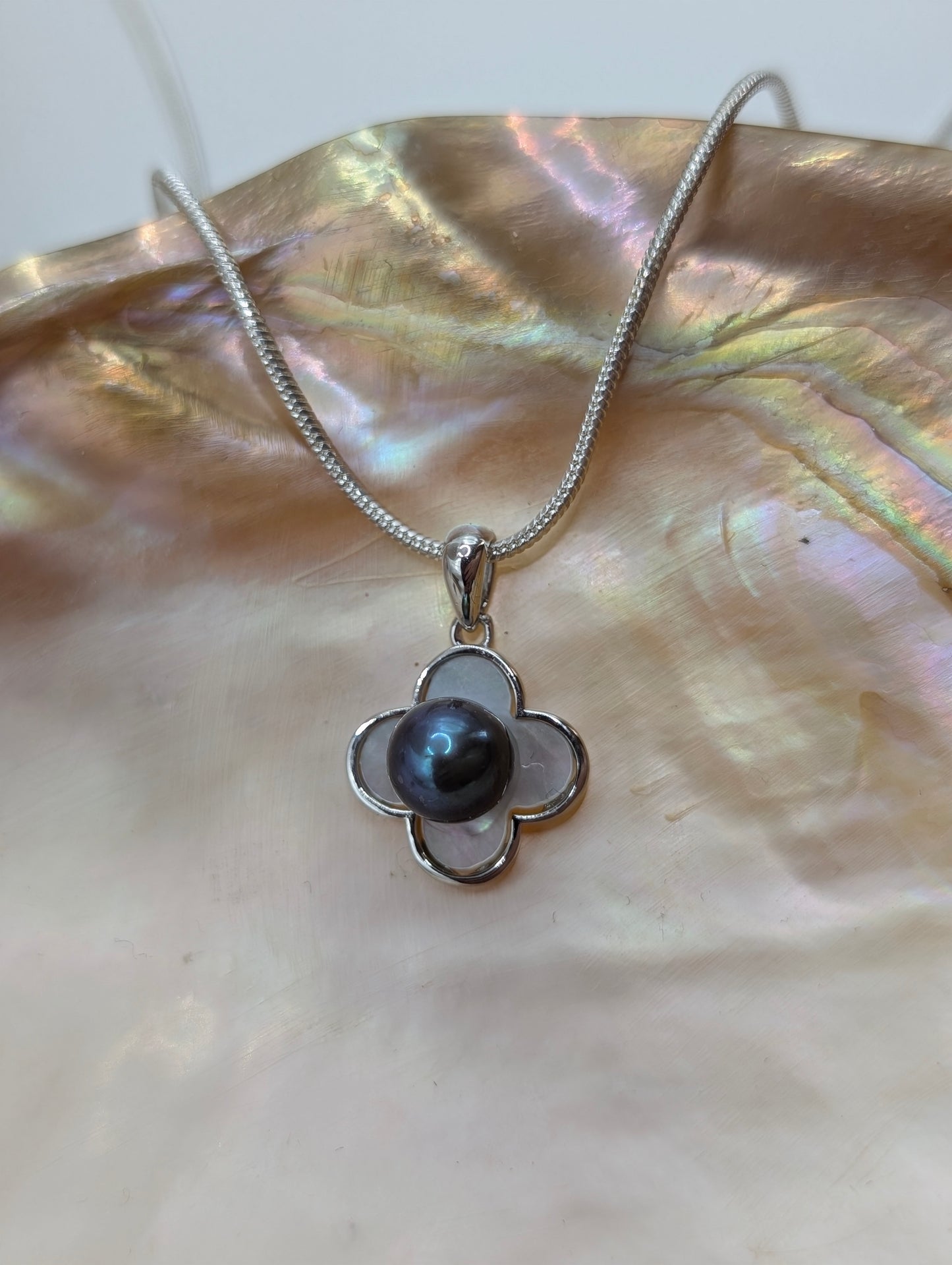 Mother of pearl inlay cover with dark deep ocean blue pearl