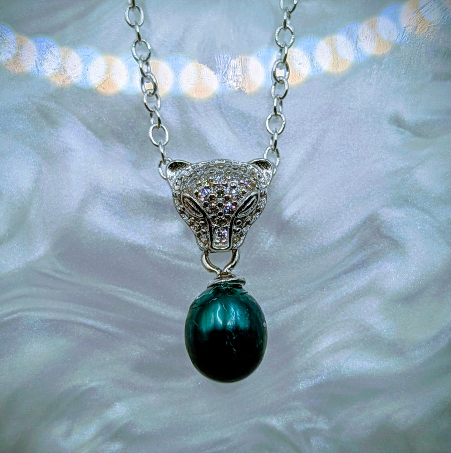 Jaguar head pendant with emerald green pearl