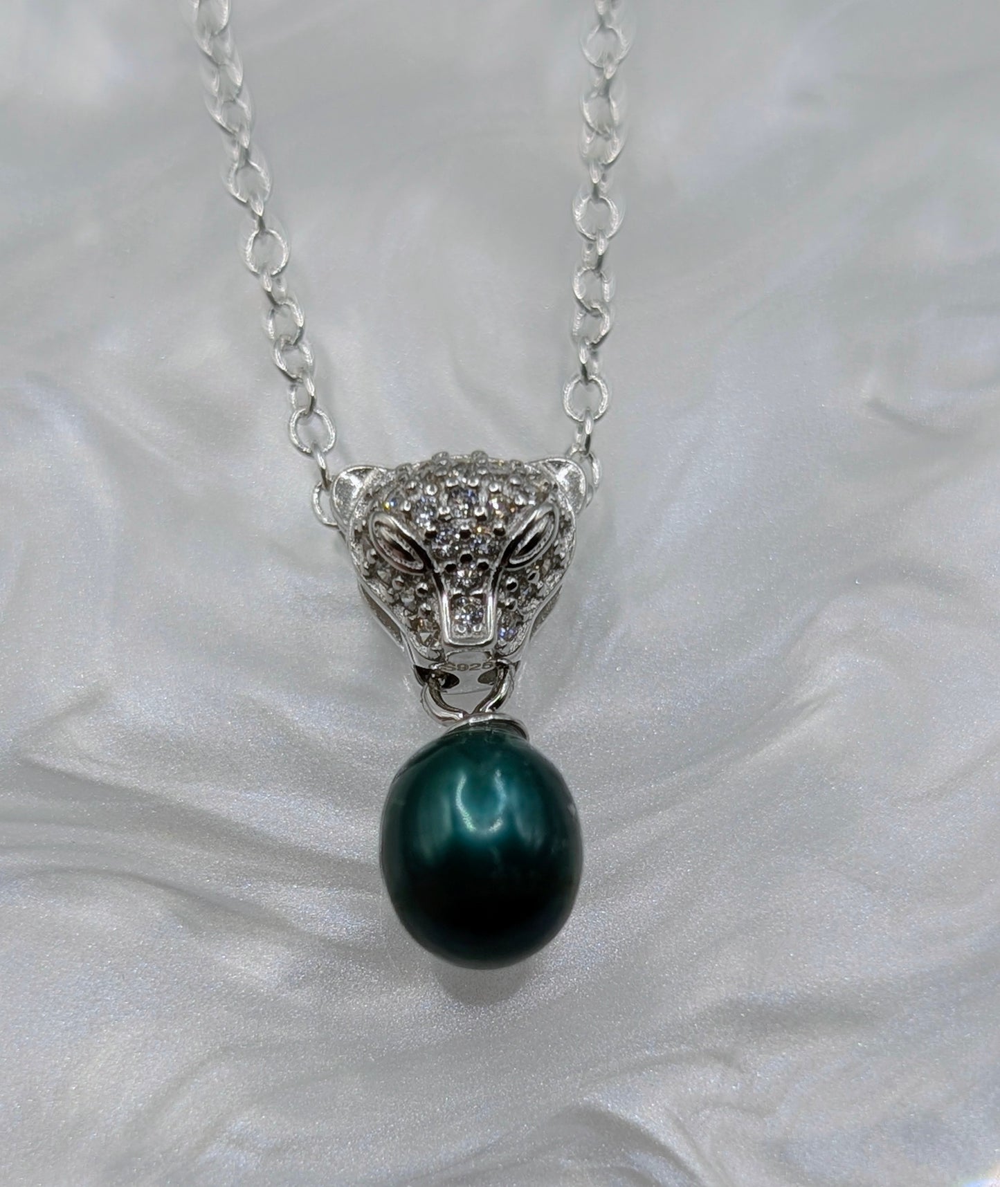 Jaguar head pendant with emerald green pearl