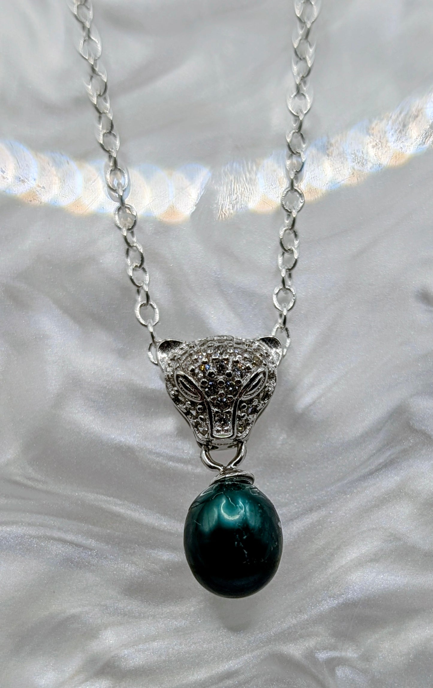 Jaguar head pendant with emerald green pearl