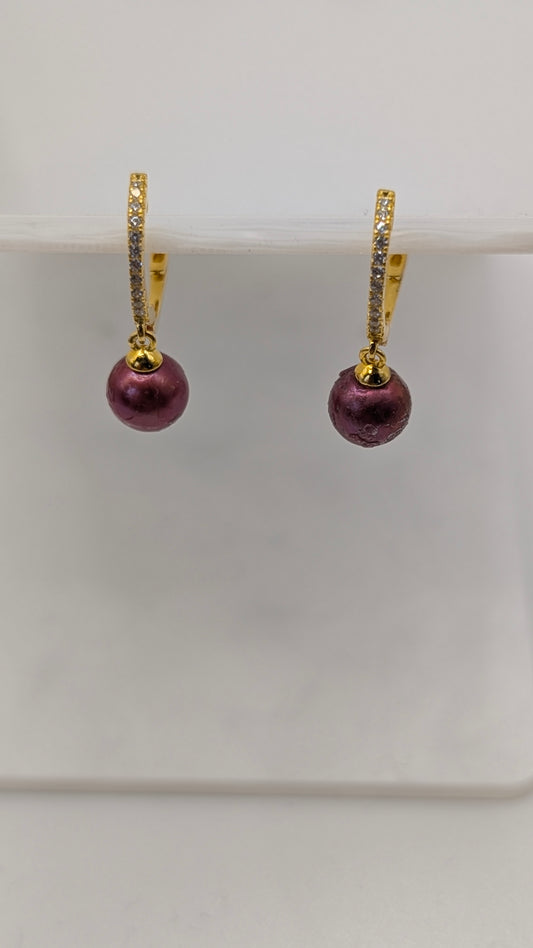 Gold huggy, red pearl earrings
