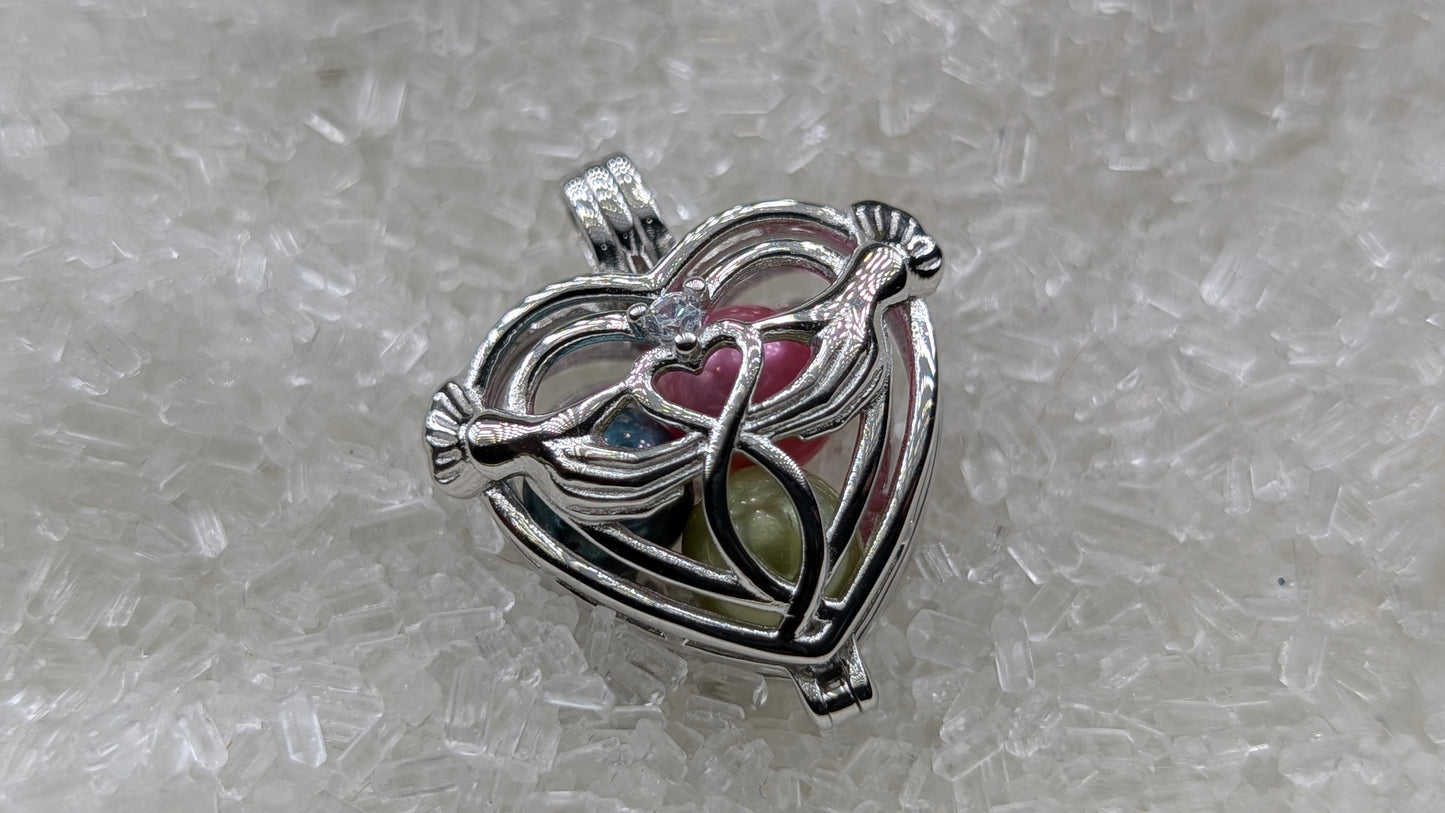 Hand holding heart large cage