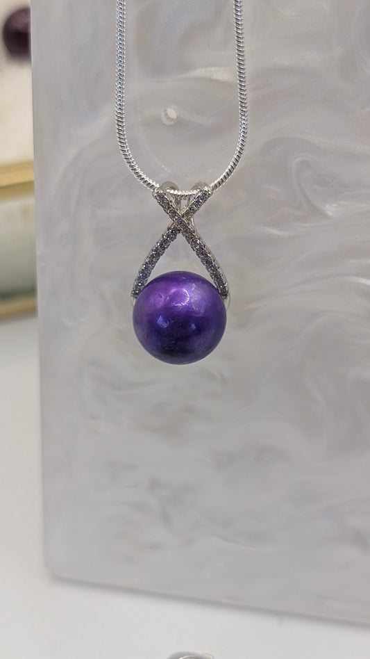 Cadbury purple cross over pendant